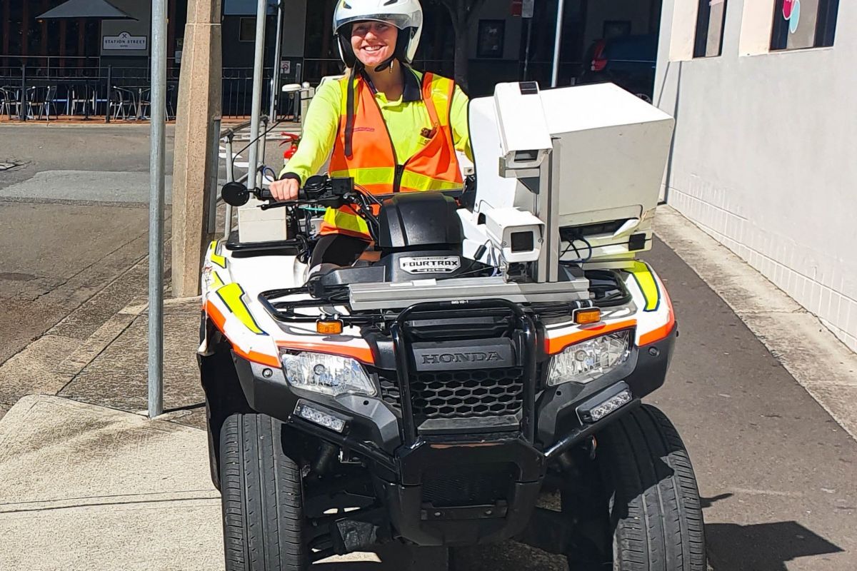 A woman on a modified quadbike that is used to assess footpath conditions. 