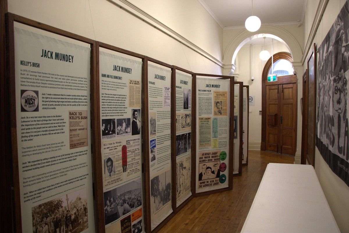 An series of images and text run down a corridor wall