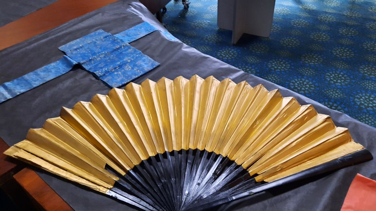 Japanese Hand fan made by made by set designer Peter Barton, used in the performance from the Teahouse of the August Moon at the grand opening of the Wagga Civic Theatre in June 1963.