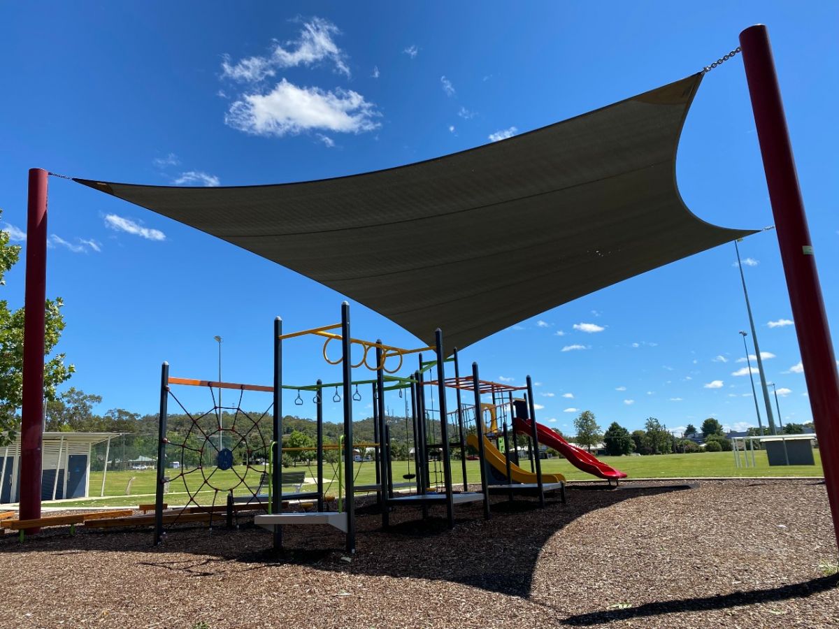 A shade sail over playground equipment