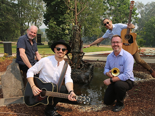 Local performers with The Groove Factorie (from left) Dave Wall, Nathan Lamont, Andrew Heap and Dale Allison catch up with an old favourite at Victory Memorial Gardens this week.