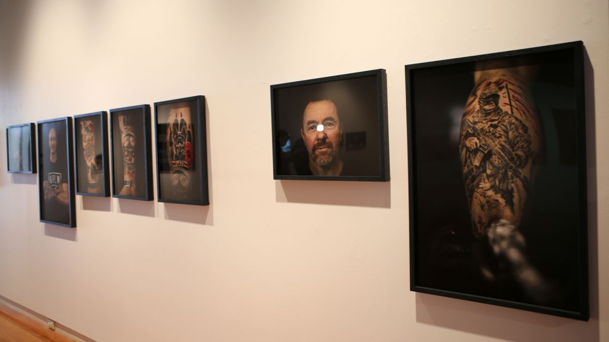 portraits and photos on gallery wall