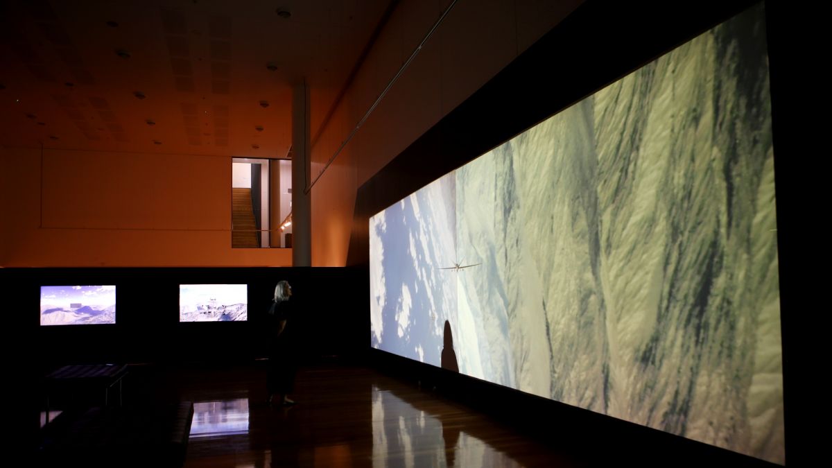 large screens with drone images