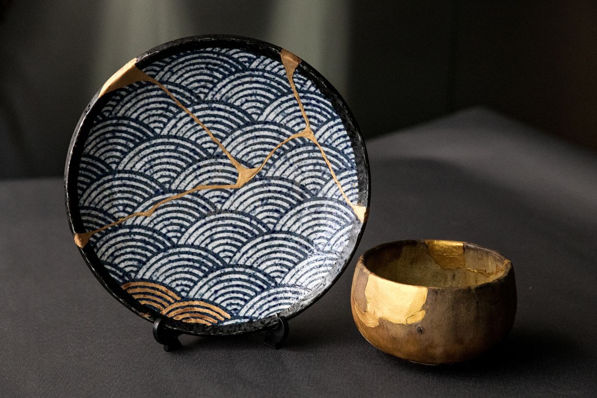 Two pieces of pottery created through art of Kintsugi
